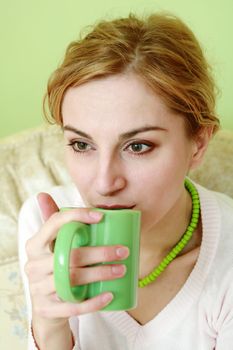 An image of a woman drinking tea