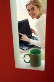 An image of a woman with a laptop