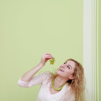 An image of a girl with grapes