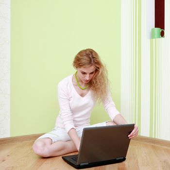 An image of a girl with a laptop