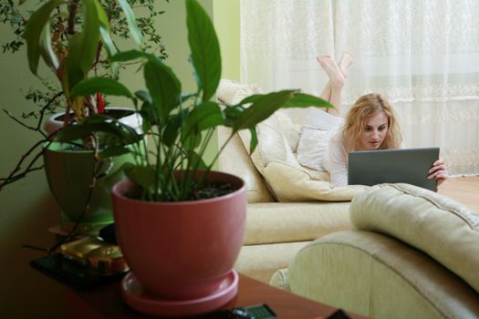 An image of a nice woman on a sofa