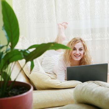 An image of a nice woman on a sofa