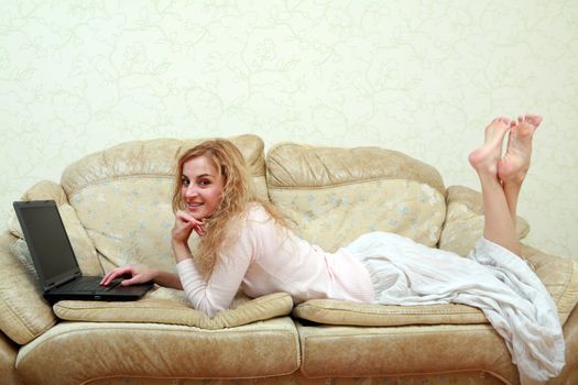 An image of a girl working with laptop