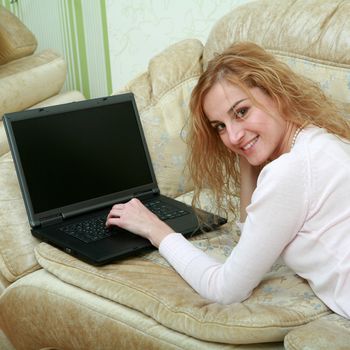 An image of a girl working with laptop