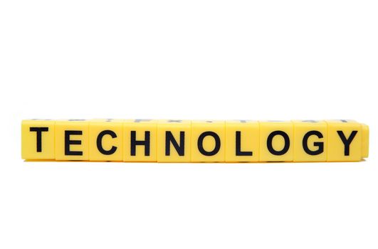 An image of yellow blocks with word ''technology'' on them