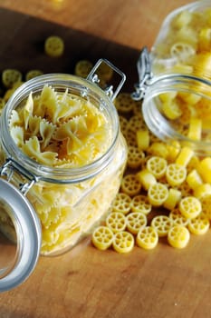 An image of yellow pasta in two jars