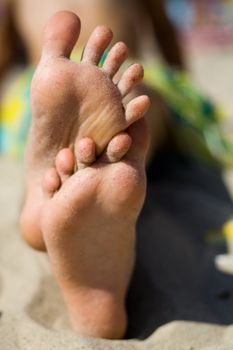 An image of funny little feet on the sand