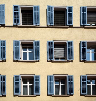 An image of group of windows of a big house