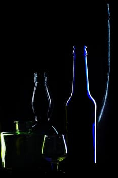 An image of glasses bottles on black background