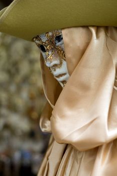 An image of a mannequin in venetian mask