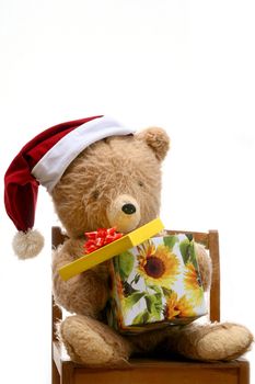 An image of bear toy with gift