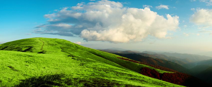 Stock photo: an image of bright green mountains and blue sky