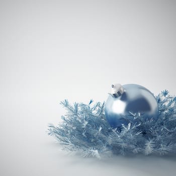 Christmas ball of gentle blue color in an environment of a tinsels and decorations