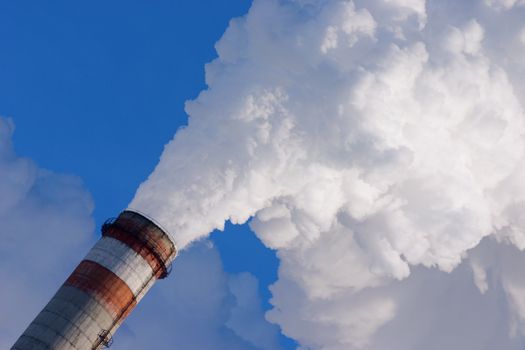 smoking pipe of factory, contaminating an environment on a background clean sky