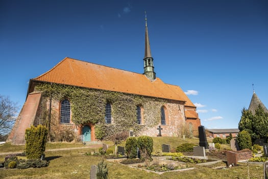 Red brick church  on sunny days in spring in a small village of north Germany