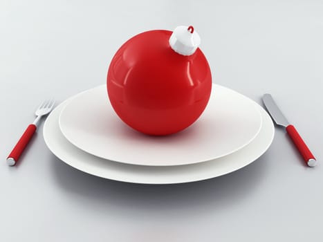 red christmas ball on a white plate in environment of silverware