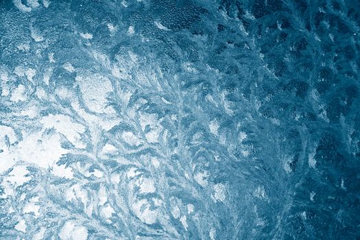 texture of the blue frozen ice on a glass surface