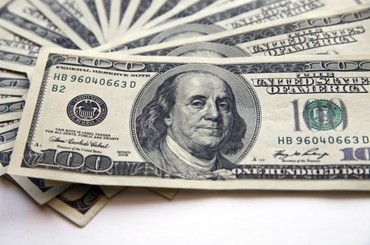 pile of dollar banknotes on a white background