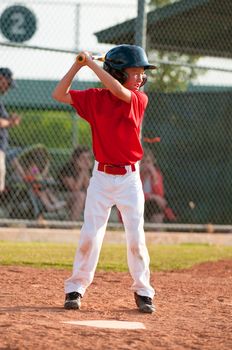 Little league baseball player at bat