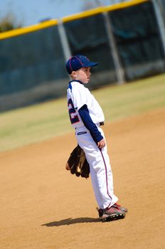 Youth player on baseball field.