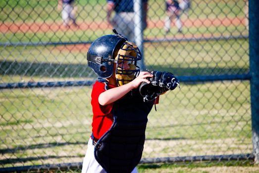 Little league baseball catcher.