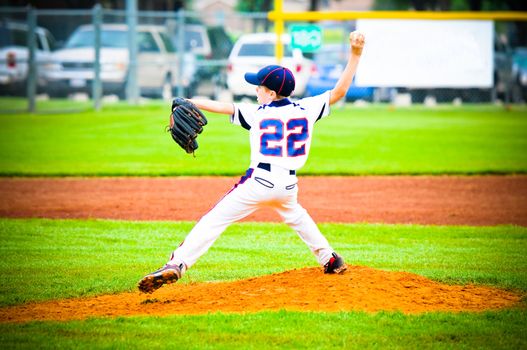 Little league pitcher about to throw the pitch