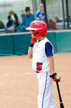 Little league baseball batter on deck.