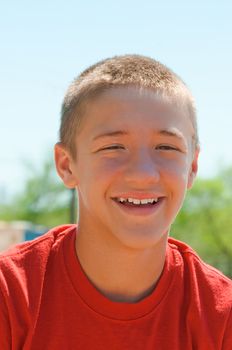 Teenage boy happy and smiling up close