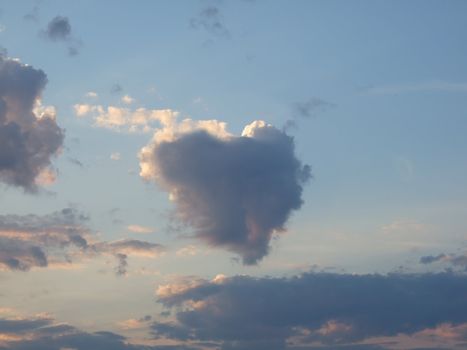 The present cloudy heart in the sunset sky