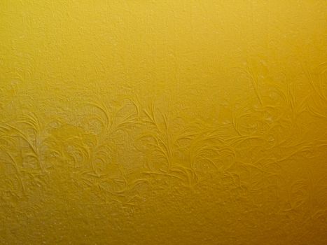 Frosty pattern on a yellow wall