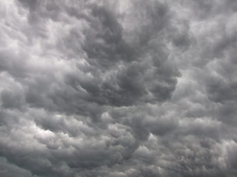 Dark, dense and magnificent, gray storm clouds