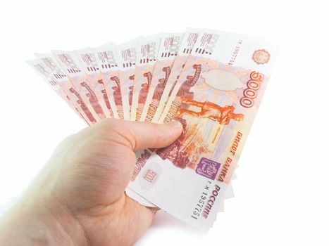 The isolated five-thousandth of Russian rubles denominations in a hand
