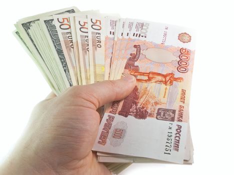 The isolated denominations of dollars, euro and the Russian rubles in a hand