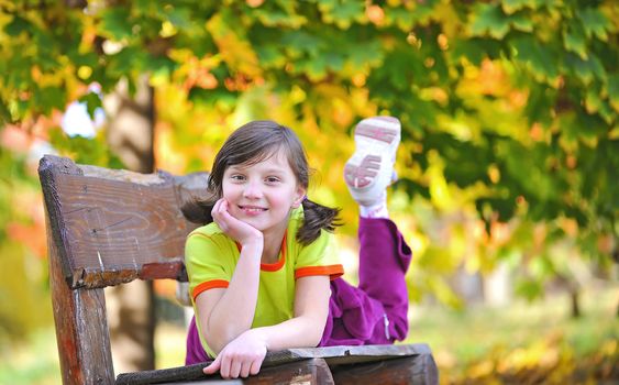 girl laying down on a bench