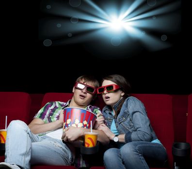 couple in a movie theater, watching a 3D movie