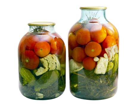 canned tomatoes and cucumbers in a glass jar isolated on white background