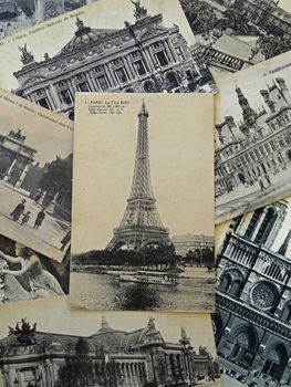 bunch of vintage postcards of Paris with the Eiffel tower