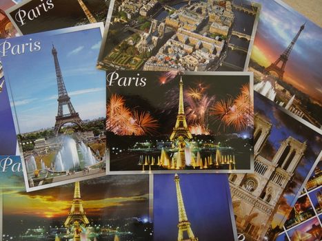 bunch of postcards of Paris with the Eiffel tower