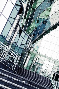architectural metal and glass with reflections as urban background