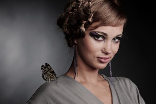 woman and butterfly on black