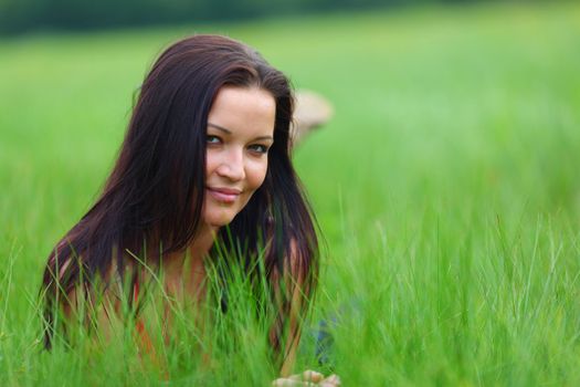 woman on grass in green fields