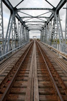 old metal railway bridge and rails