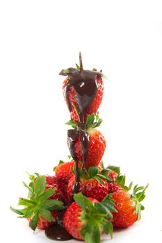 Picture of a tower of strawberries with melted chocolate poured over