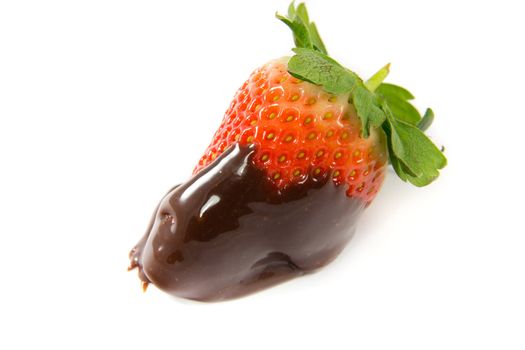 A picture of a single strawberry dipped in melted chocolate