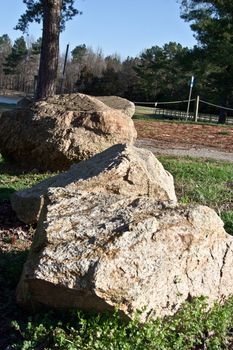 A horazontal view of a line of boulders.