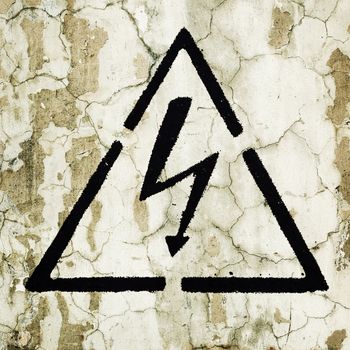A warning sign painted on the wall - Electricity