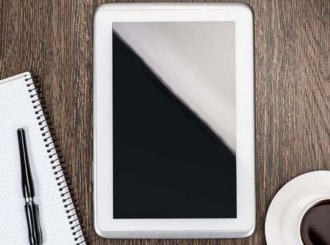 pen, coffee and tablet on the table, workplace businessman