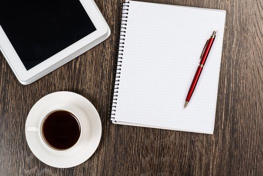 pen, coffee and tablet on the table, workplace businessman