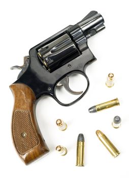 Wood Handled Revolver 38 Caliber Pistol Loaded Laying With Bullets