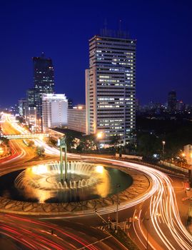 Night time view of traffic in the center of business district in Jakarta